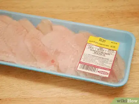 Step 1 在肉铺或食品杂货店挑选罗非鱼。