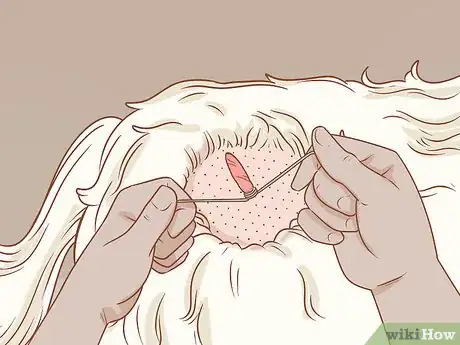 Step 2 如果你想要让皮赘慢慢自行脱落，也可以用线把它勒紧。