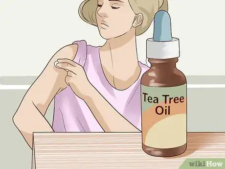 Step 2 涂抹茶树油。