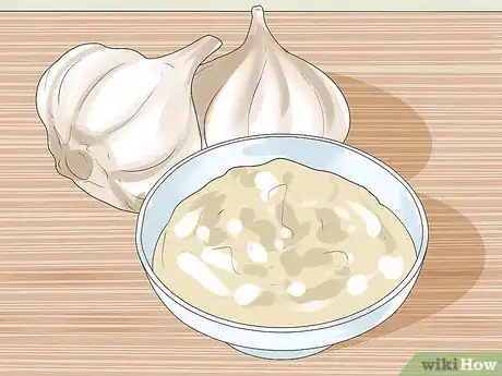 Step 5 涂抹大蒜泥。