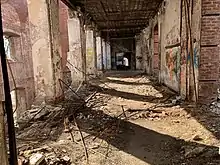 A charred and dilapidated hallway in the "Memorial Hall" building.