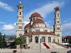 Church in Korçë. The Albanian Orthodox Flag Can be Seen Flown on the left Tower.