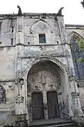 The north porch of the church, on the street side, has not yet been cleaned by restorers.