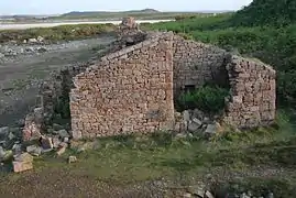 A ruined building by a quarry