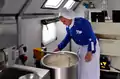 Bread dough being prepared in a Russian Armed Forces PAK-200M vehicle kitchen