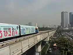 BTS Skytrain heading to Lat Phrao Square above Phaholyothin Road (taken from Chomphon side)