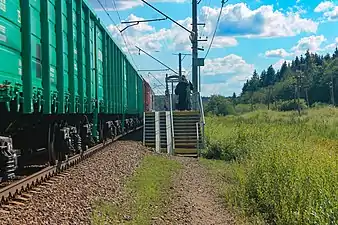 Freight train is passing platform towards Oredezh