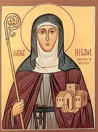 Saint Hilda holding  Whitby Abbey