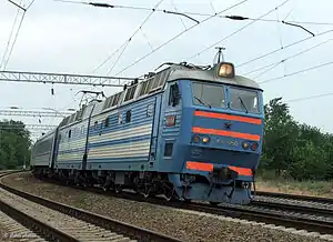 ChS8 class locomotive pulling a passenger train