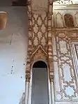 Intrado of the arch (above) next to the mihrab, as well as the opening leading to the imam's entrance (below)