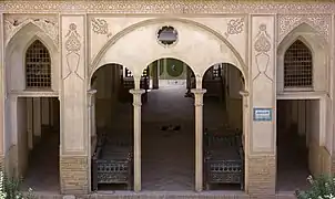 An exterior view of lower-floor hallways inside the Abbāsi House.