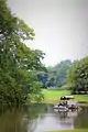 Lake and trees with water turbine