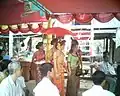 A bride is going to greet a groom in Groom Procession Ceremony