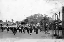 Image 13Japanese high-school girls playing football in their traditional hakama with one team wearing sashes (c. 1920) (from Women's association football)