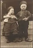 Dutch siblings from the Island of Marken, holding religious tracts