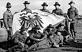 New Zealand troops displaying a captured German flag in Apia