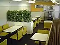 Interior of former buffet car 37-7302 in set R62 used as a general lounge area in May 2002