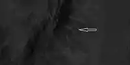 Close view of ridges from previous HiRISE image Arrow indicates an "X" shaped ridge.