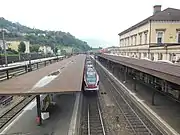 Station building and platforms from the footbridge, looking south