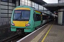 A train waiting at a built-up station platform