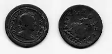 both sides of a small copper coin (the farthing) with a man's head on one side and Britannia on the other