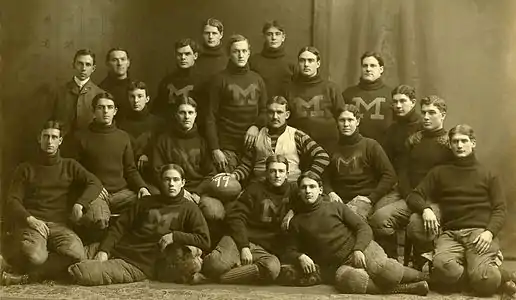 Image 131899 Michigan Wolverines football teamPhotograph: Fred RentschlerOfficial portrait of the 1899 Michigan Wolverines football team, an American football team which represented the University of Michigan in the 1899 season. Coached by Gustave Ferbert, the Wolverines opened the season with six consecutive shutouts, outscoring opponents in those six contests by a combined score of 109 to 0. However, they finished the season by going 2–2 in their final four games, losing against the University of Pennsylvania Quakers and a championship game against the Wisconsin Badgers.More selected pictures