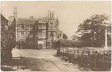 Black and white postcard of East Knoyle, showing the war memorial