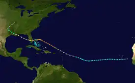 A track begins just west of the tip of Senegal in West Africa: it moves south by west, passing just south of a group of islands called Cape Verde; it curves southwest, then northwest, passing above Puerto Rico and some islands; it curves to the west, crosses the northern edge of some islands called the Bahamas, and then hits a protruding peninsula called Florida; it crosses that peninsula, goes over a body of water called the Gulf of Mexico, and then curves northwest toward land; it hits a bird’s-foot-shaped edge of land called the Mississippi Delta, which is part of a larger land called Louisiana, part of a large continent called North America; it finally moves over land and curves north near the end of the track.