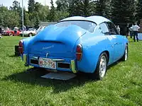 Rear of a 1959 750 GT Zagato, showing the double-bubble roof and the distinct engine lid necessary to clear the pushrod engine's upright carburetor and air cleaner