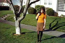 American girl wearing a mini skirt and patterned tights, 1966.