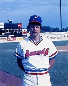 A baseball player in white