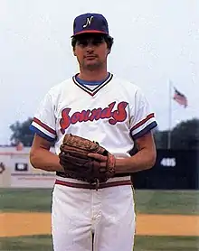 A baseball player in white