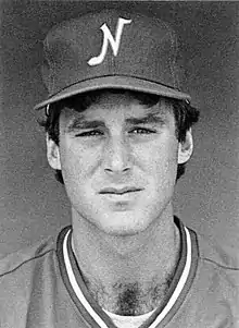 A black and white photograph of a baseball player