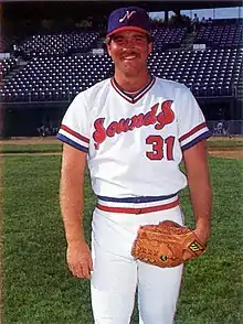 A baseball player in red, white and blue