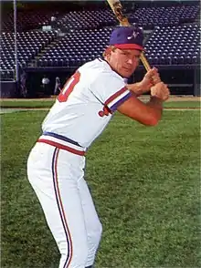 A baseball player in red, white and blue