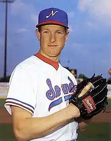 A baseball player in white