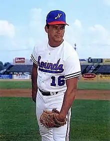 A baseball player in white