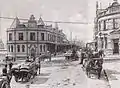 Archival shot of Sussex Street with the Corn Exchange on the left