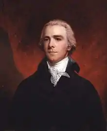 Painting shows a man with gray hair. He wears a black suit with a white ruffled shirt at his neck.