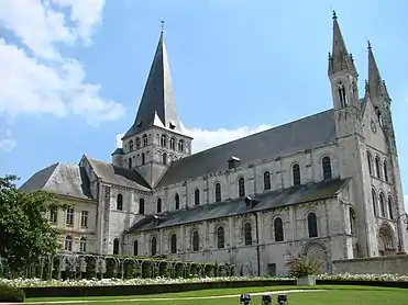 Saint-Georges de Boscherville Abbey, France, has a square tower over the crossing. The western pinnacles are in the Gothic style.