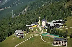 A wider view of the resort, showing the balloon loop, a tramcar, and the route to the station