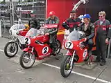 Winners Presentation 350 cc Junior Classic Race – Ian Moore (9), Chris Palmer (2) & Chris Swallow (17) TT Grandstand  Tuesday 28 August 2012