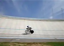 A cyclist riding on the velodrome