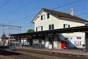 Three-story building with gabled roof