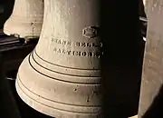 This is an image of the 8th Bell in the Highland Arts Theatre Chime, showing the inscription "MC SHANE BELL FOUNDRY CO., BALTIMORE, MD., 1911" on its waist. This bell weighs 575 lb (261 kg).