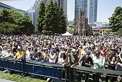 Large crowd of people attending a concert at Yerba Buena Gardens Festival in San Francisco