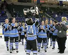 Harrison Browne of the Buffalo Beauts lifts the 2017 Isobel CupIsobel Cup.