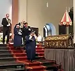 Nuns with reliquaries on the choir stairs