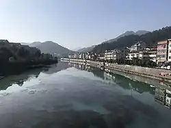 Residential buildings alongside the Mei Stream.