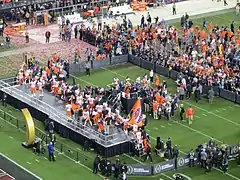 Clemson players take the stage to receive the trophy.